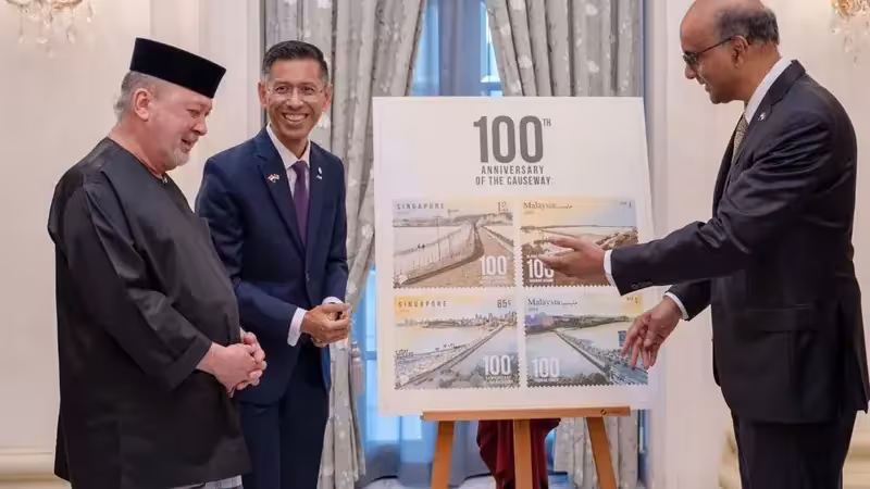 Commemorative stamps marking 100 years of the Causeway unveiled at the Istana